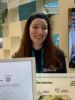 Photo de la doctorante Alice Josserand sur  un stand au SIA